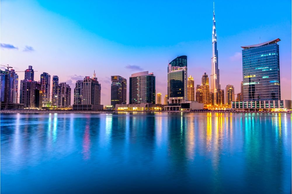 Panoramic view of the Dubai skyline with modern skyscapers and luxury resorts at sunset