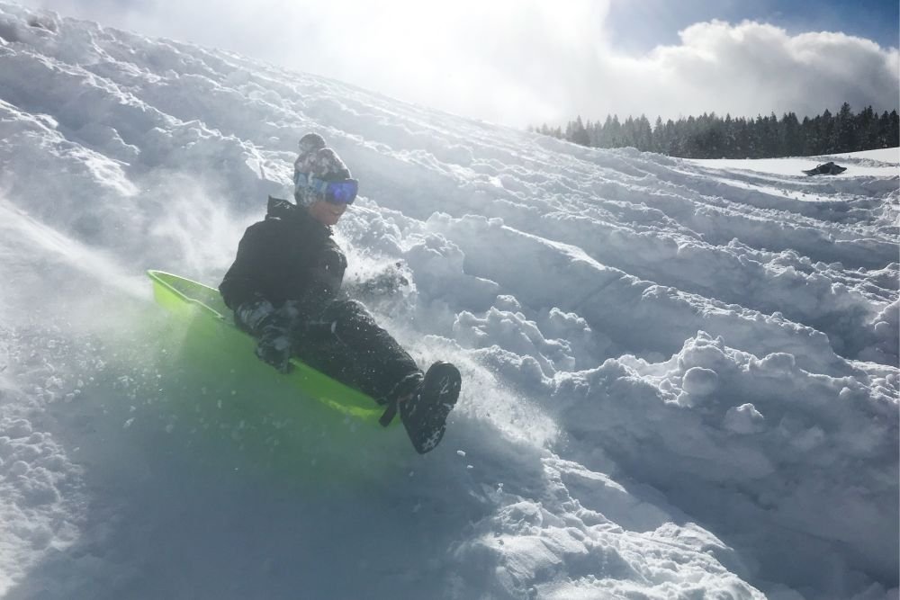Child sledding at Lake Tahoe