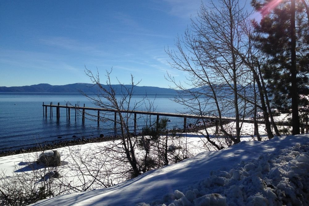 Lake Tahoe Beach covered in snow in winter.
